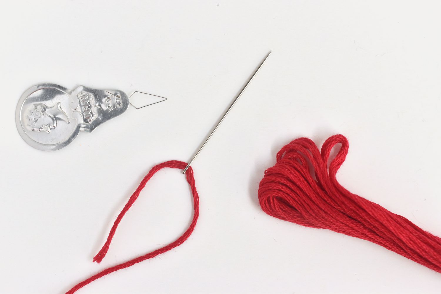 hand embroidery needle, thread and threader